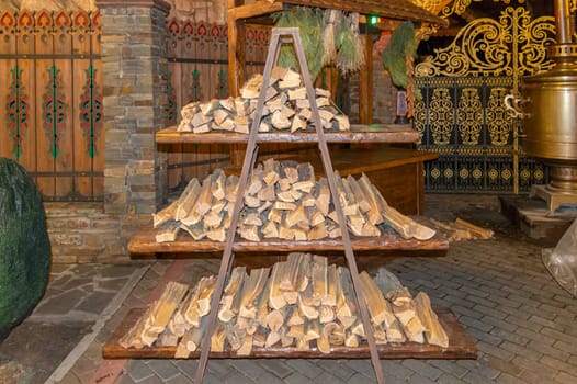 a woodpile and a samovar in the Russian courtyard. photo