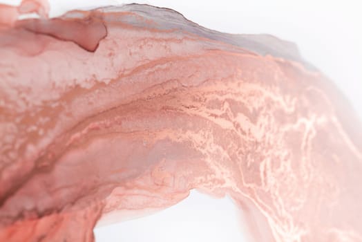 A close-up abstract image of a swirling ink pattern in delicate rose hues on a white background.