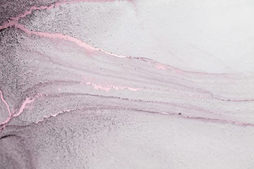 A close-up abstract image of a soft pink and white gradient background with thin, golden veins.