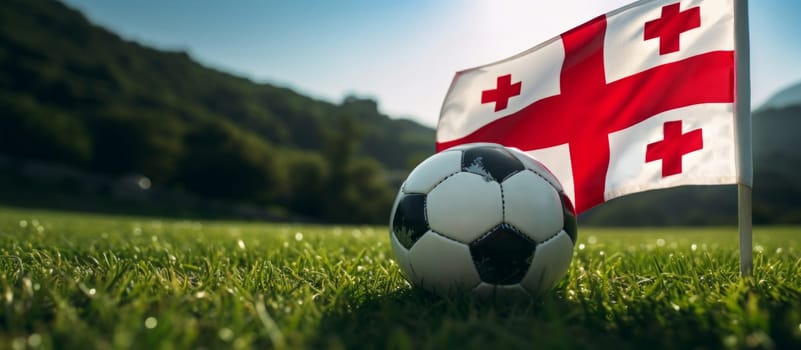 Socker Ball against Georgia country flag on green grass background. Euro 2024 championship event banner. . High quality photo