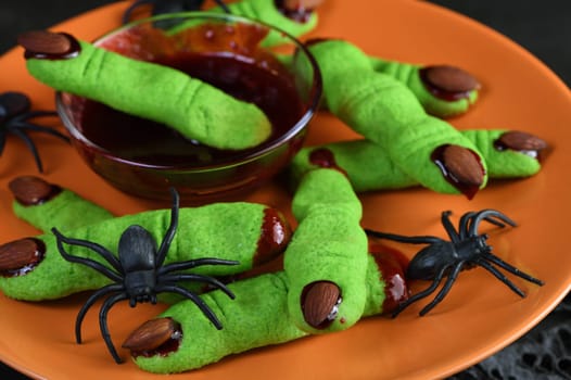 A delicious Halloween treat, Witch's Fingers Green Sugar Cookies with raspberry jam and almonds are the perfect choice for  paleo, vegan look.