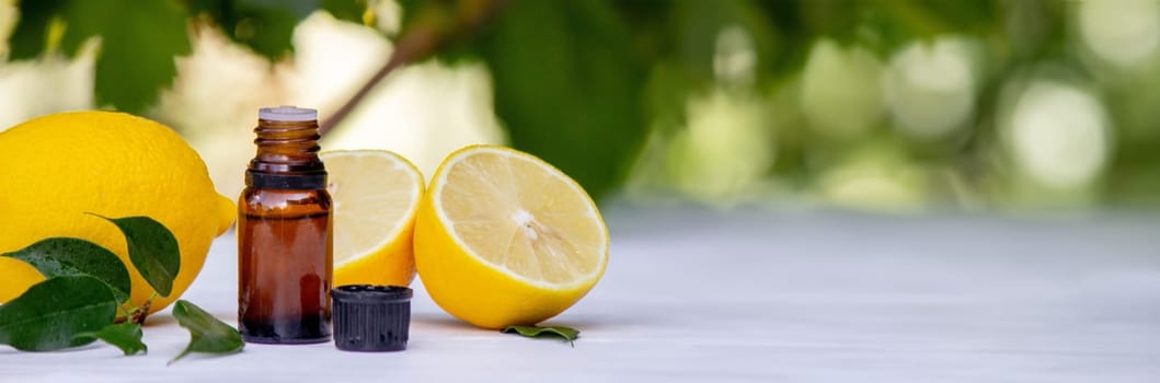 lemon oil in jars, fresh lemon. Selective focus. Nature