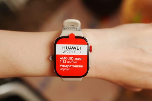 Tyumen, Russia-June 20, 2024: Sleek White Huawei Watch Fit 3 on a Wrist