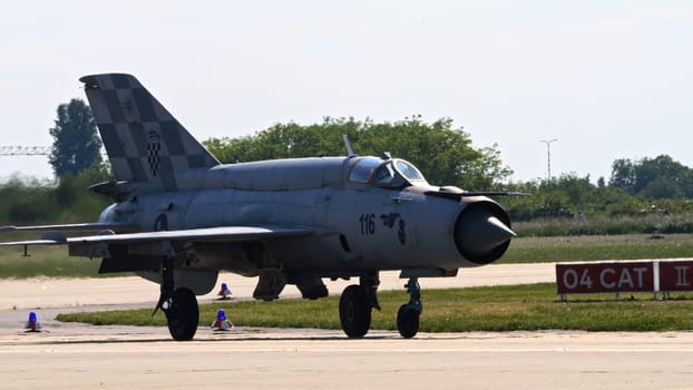 Zagreb Croatia May 11 2024: Combat aircraft taxiing on runway. Copy Space. Mikoyan Gurevich MiG-21 Fishbed of Croatian Air Force.