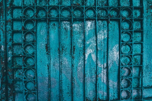 Metal texture covered with old blue paint with scratches and wear