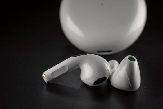 ROSTOV-ON-DON, RUSSIA - APRIL 28, 2018: Apple AirPods wireless Bluetooth headphones and charging case for Apple iPhone. New Apple Earpods Airpods in box.