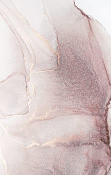 A close-up abstract painting featuring pink and gold hues, showcasing the flowing and swirling patterns of watercolor paint.