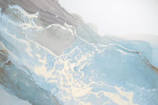 A close-up abstract painting featuring a swirling blend of light blue and gray watercolor. Delicate white veins trace through the paint, creating a dynamic and ethereal effect.