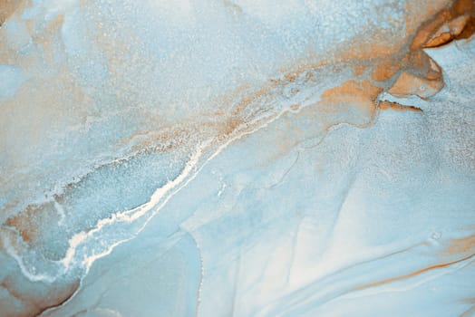 A close-up abstract image showcasing swirling patterns in shades of blue and white. The textures resemble water or ink, creating a dreamy, ethereal effect.