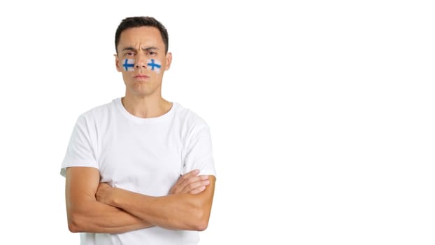 Dignified and serious man with finnish flag painted on face looking the camera with dignity