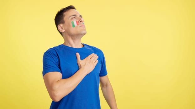 Photo of Italian patriot listening to the national anthem with solemnity
