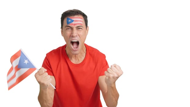 Man passionately cheering for Puerto Rico screaming and waving a national flag