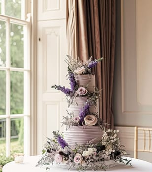 Wedding cake with lavender flowers. Festive table decoration.