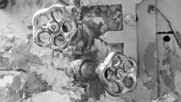Steam engine controls...Two sulfur shabby retro taps for shutting off the water close-up.
