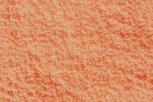 Abstract rough relief background in orange color.