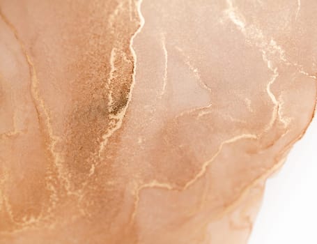 A close-up image of a peach-colored background with swirls of golden ink. The ink creates an abstract pattern of lines and shapes, reminiscent of flowing water.