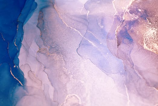 A close-up image of teal and white ink swirling together, creating a beautiful abstract pattern.
