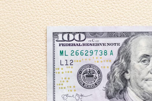 Close up shot of the US dollars note bill on the white leather background