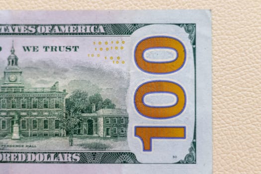 Close up shot of the US dollars note bill on the white leather background