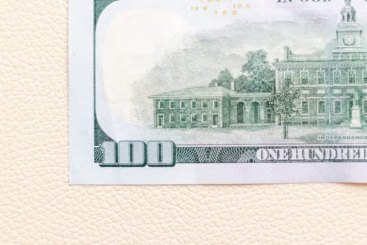 Close up shot of the US dollars note bill on the white leather background