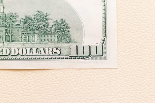 Close up shot of the US dollars note bill on the white leather background
