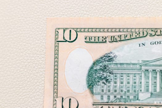 Close up shot of the US dollars note bill on the white leather background