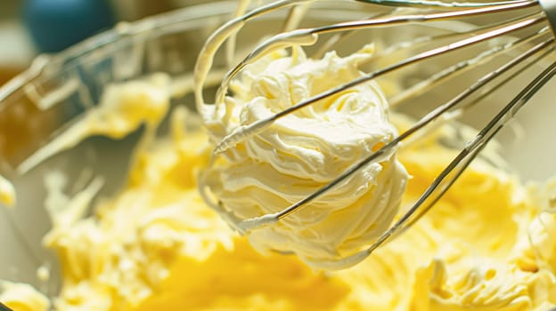 Whisk in bowl with creamy yellow batter, butter or custard, homemade baking and traditional food, country life