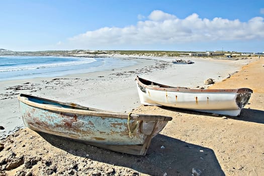 Two dinghies on the beach at Hondklipbaai on the Northern Cape Atlantic Coast