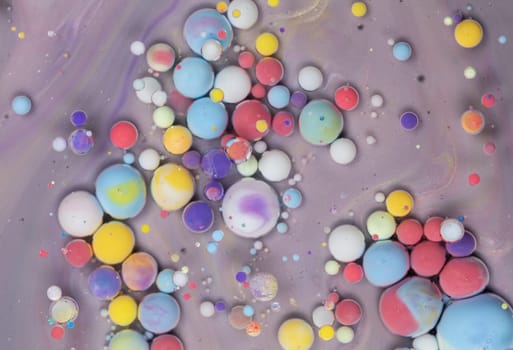 A Symphony of Spheres in Lavender HA close-up shot of vibrant, colorful spheres suspended in a lavender liquid, creating a mesmerizing abstract pattern.ues. High quality photo
