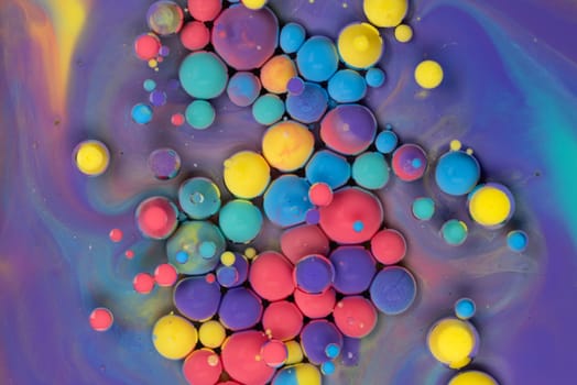 A Symphony of Spheres in Lavender HA close-up shot of vibrant, colorful spheres suspended in a lavender liquid, creating a mesmerizing abstract pattern.ues. High quality photo