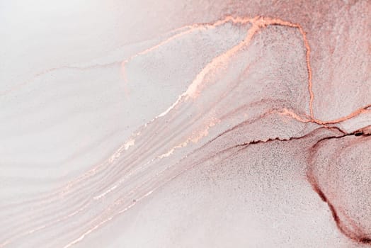 A close-up image of abstract swirls of rose gold ink on a white canvas. The ink has created a delicate and intricate pattern, with subtle variations in color and texture.