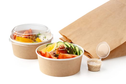 Take out poke bowls with craft bag isolated on white background close up