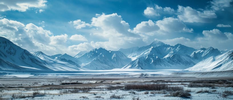 The expansive arctic landscape breathes tranquility with its endless snow-covered plains and distant mountain range under a sky scattered with soft clouds