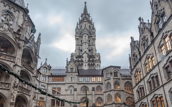 Munich, Germany - Dec 21, 2023 - Exterior architecture of famous New Town Hall (Neue Rathaus) on Marienplatz square in Munich. Gothic architectural style. Upper Bavaria, Space for text, Selective focus.