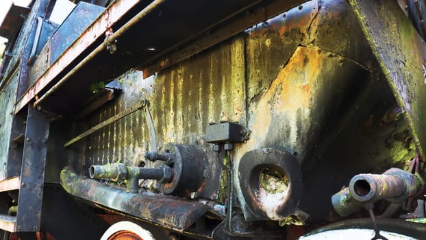 Chassis of an old steam locomotive. Detail of one wheel of a vintage steam train locomotive