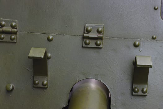 Protective armor shield from artillery guns, green. The surface of the armor of military equipment.