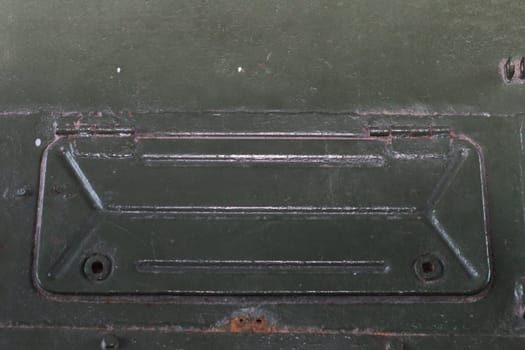 Technical niche with a lid with holes for screws. Tank hatch. Closed window.