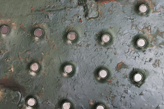 Fragment of a staircase from old military equipment. Metal side.