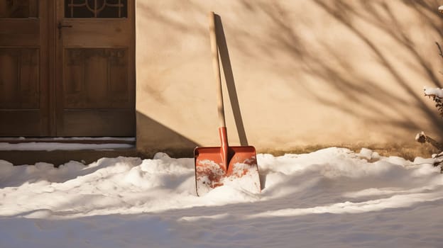 snow shovel in the snow . High quality photo