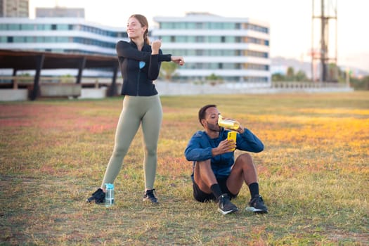 Youngs athletes using apps on their phone to track their exercise routine while training