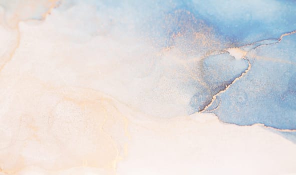 A close-up of abstract watercolor swirls in blue, gold, and white, creating a soft and ethereal effect.