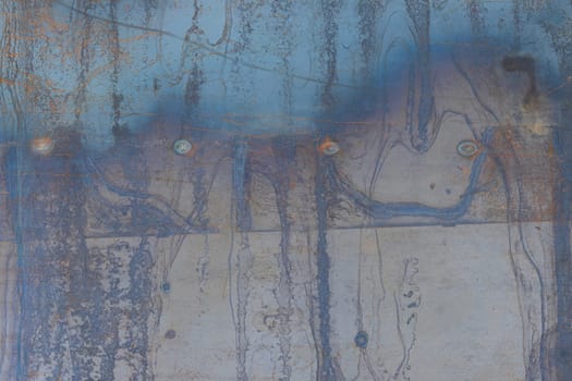 Steel surface sheet with blue and yellow streaks for grunge design background.