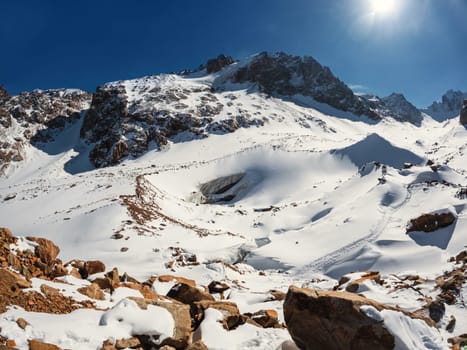 Experience the captivating beauty of Central Asia with the Bogdanovich Glacier in Kazakhstan's Almaty Mountains, nestled within the scenic Ile Alatau National Natural Park.