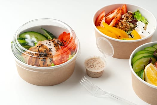 Tasty take out poke bowls isolated on white background close up