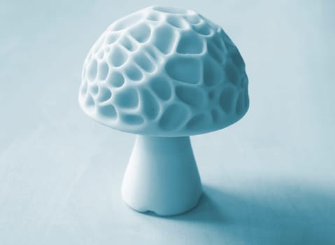 Object in the form of mushroom printed on a 3D printer. Three-dimensional model printed on a 3D printer from molten plastic of red color. Concept 3D Printing. FDM 3D Printing technology
