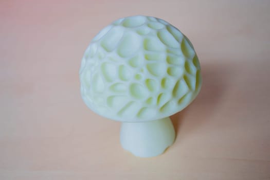 Object in the form of mushroom printed on a 3D printer. Three-dimensional model printed on a 3D printer from molten plastic of red color. Concept 3D Printing. FDM 3D Printing technology