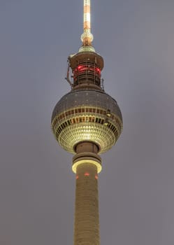 Berlin, Germany - Dec 18, 2023 - Famous Berlin Television Tower (Fernsehturm) with night sky background near Alexanderplatz in Berlin, A Tourist attraction and Meeting place, Copy space, Sective focus.