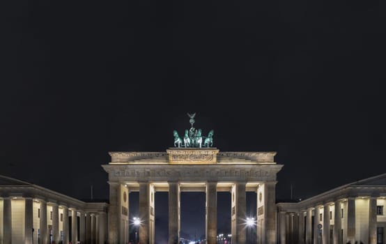 Berlin, Germany - Dec 19, 2023 - Night view of famous Brandenburger Tor (Brandenburg Gate). one of the best-known landmark and national symbols of Germany, A Tourist attraction and Meeting place, Space for text, Selective focus.