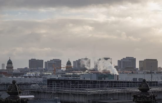 Berlin, Germany - Dec 20, 2023 - Berlin cityscape view from above of Reichstag building with Gendarmenmarkt twin churches and highrise buildings at the downtown Berlin. a major tourist attraction of the berlin city, Space for text, Selective focus.