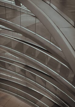 Berlin, Germany - Dec 20, 2023 - A curved walkway stretches in spirals upwards on top inside the glass dome constructed of the Reichstag building. Contemporary architecture of the Cupola of the Reichstag dome, a major tourist attraction of the berlin city, Copy space, Selective focus.